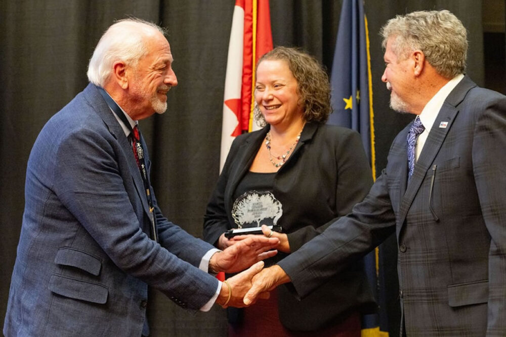 Paul McKimm, President of Crescent Energy accepts IOGCC Stewardship Award from Railroad Commissioner Jim Wright